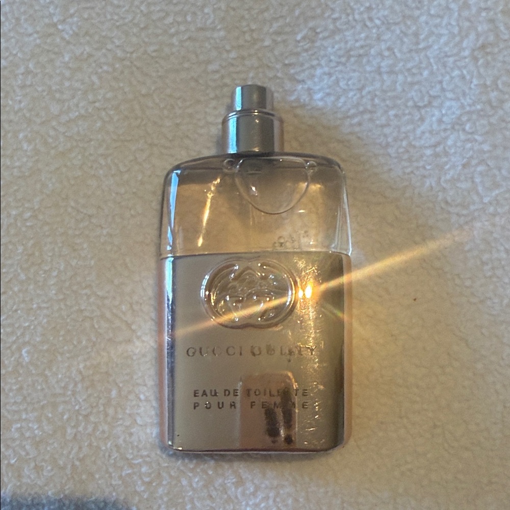 Gucci women's fragrance bottle — gold and silver finish